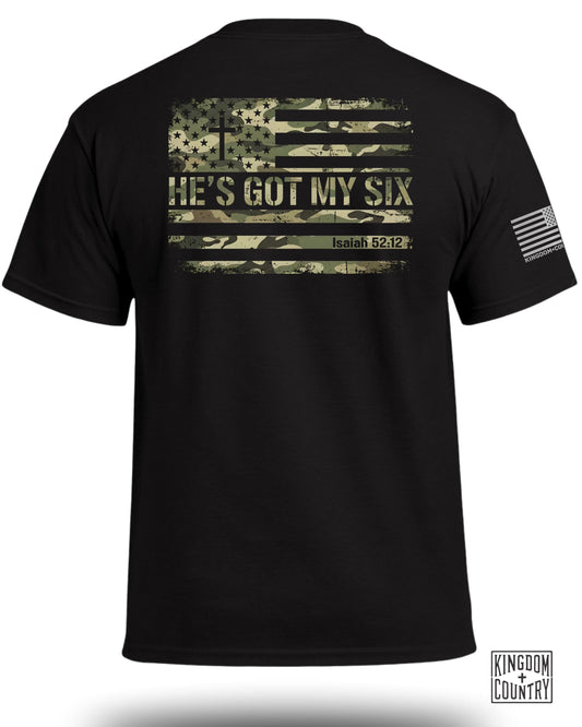 Black t-shirt with distressed American flag and camouflage pattern, text HE'S GOT MY SIX.