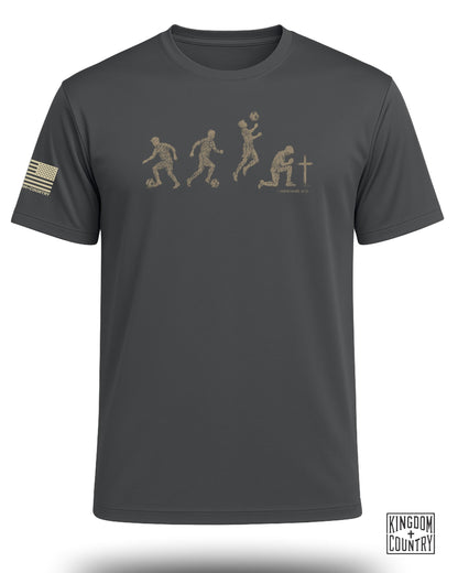 Gray t-shirt with soccer player evolution graphic and 1 Corinthians 10:31 text.