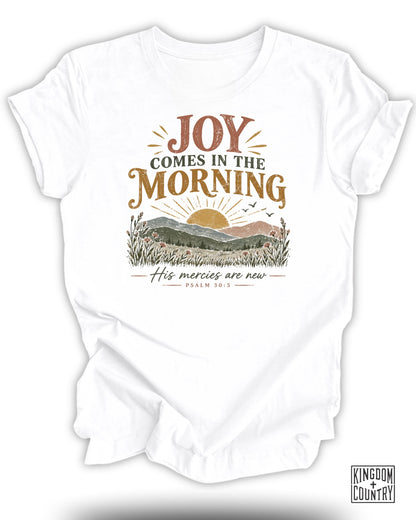 White t-shirt with "Joy Comes in the Morning" and "His mercies are new" text.