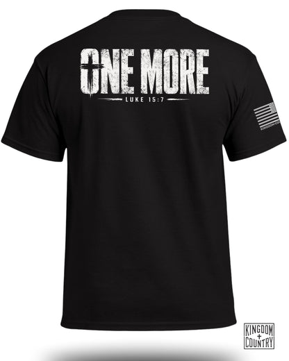 Black t-shirt with "ONE MORE LUKE 15:7" graphic and American flag logo.