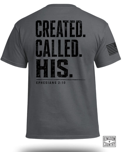 Gray t-shirt with black distressed text "Created. Called. His. Ephesians 2:10" and American flag logo.