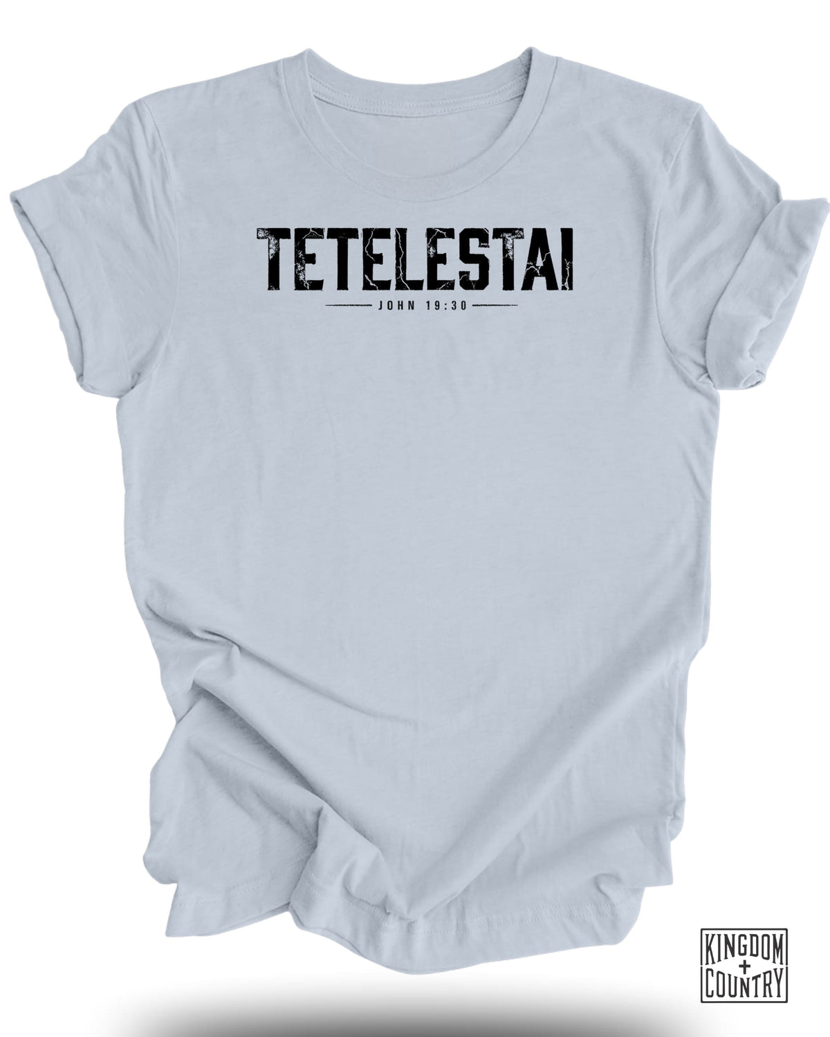 Light blue t-shirt with black text "TETELASTAI JOHN 19:30" and a logo.