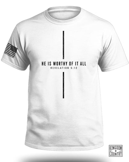 White t-shirt with "HE IS WORTHY OF IT ALL REVELATION 5:12." and American flag patch.