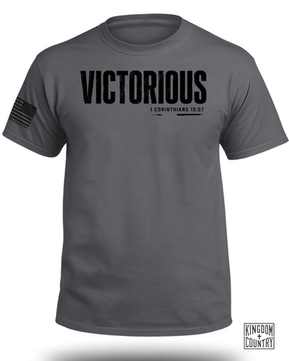 Charcoal t-shirt with "VICTORIOUS" and "1 CORINTHIANS 15:57" text.
