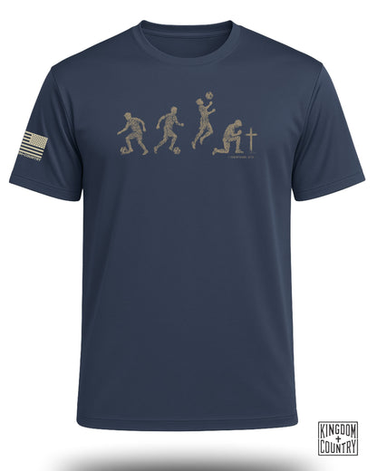 Navy t-shirt with soccer evolution graphic and 1 Corinthians 10:31.