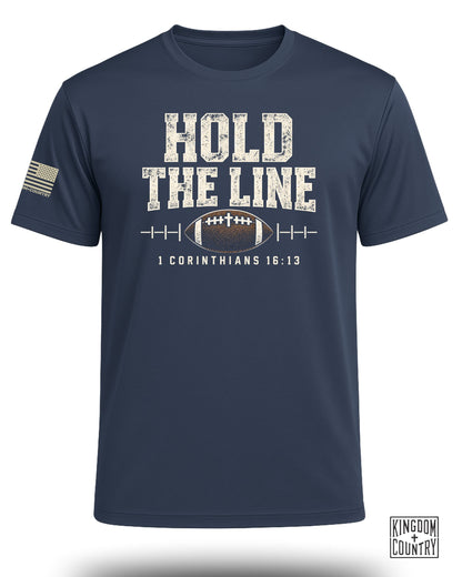 Navy t-shirt with "HOLD THE LINE" text, football, and scripture 1 Corinthians 16:13.