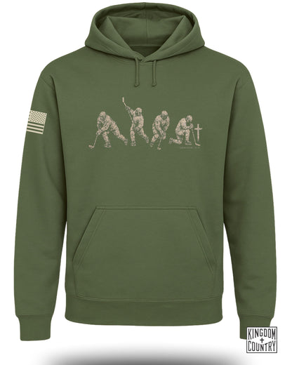 Green hoodie with hockey player graphic and 1 Corinthians 10:31 text.