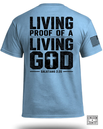 Light blue t-shirt with black text: Living Proof of a Living God, Galatians 2:20.