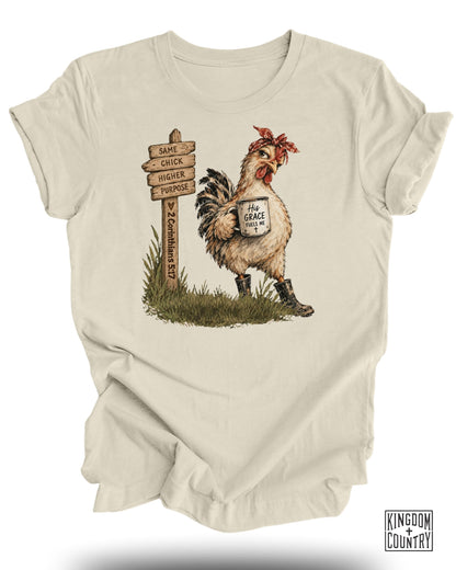 Chicken with bandana and boots holds mug, sign reads "Same Chick, Higher Purpose."