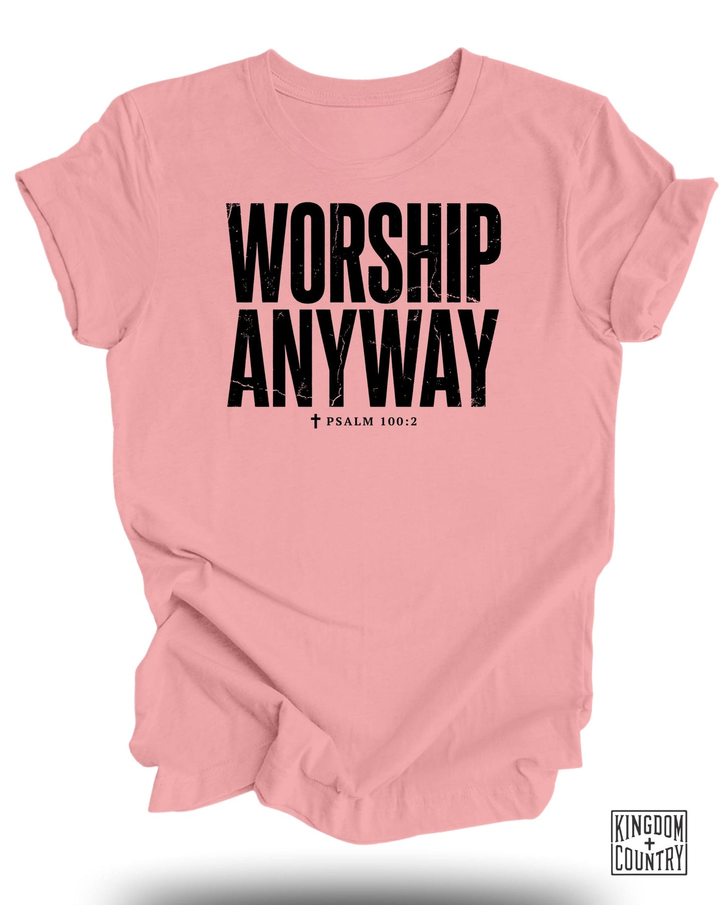 Pink t-shirt with "WORSHIP ANYWAY" and "PSALM 100:2" in black text.