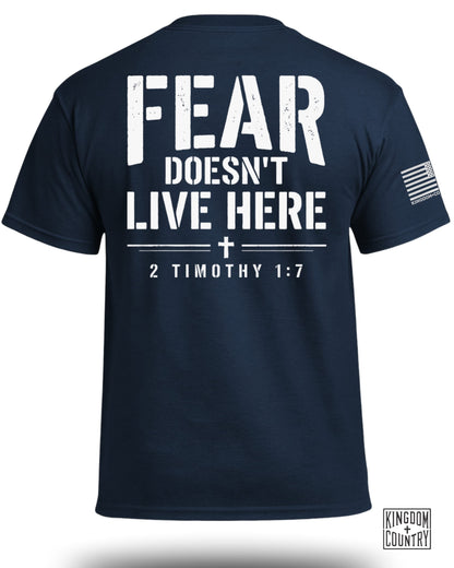 Navy t-shirt with white text "FEAR DOESN'T LIVE HERE" and "2 TIMOTHY 1:7".
