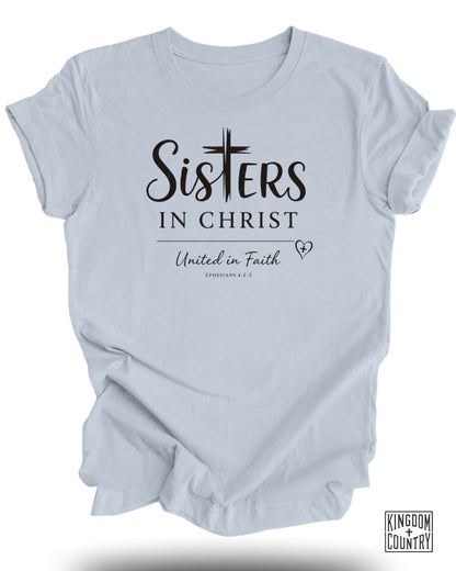 Light blue t-shirt with "Sisters in Christ" and Bible verse.