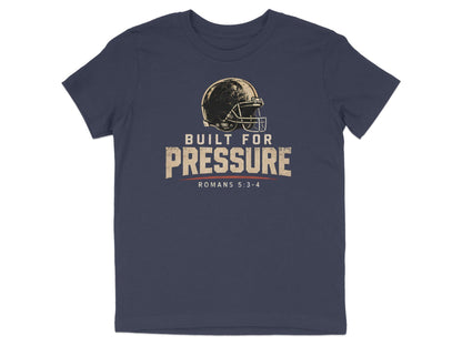Navy t-shirt with a distressed football helmet and "Built For Pressure Romans 5:3-4" text.