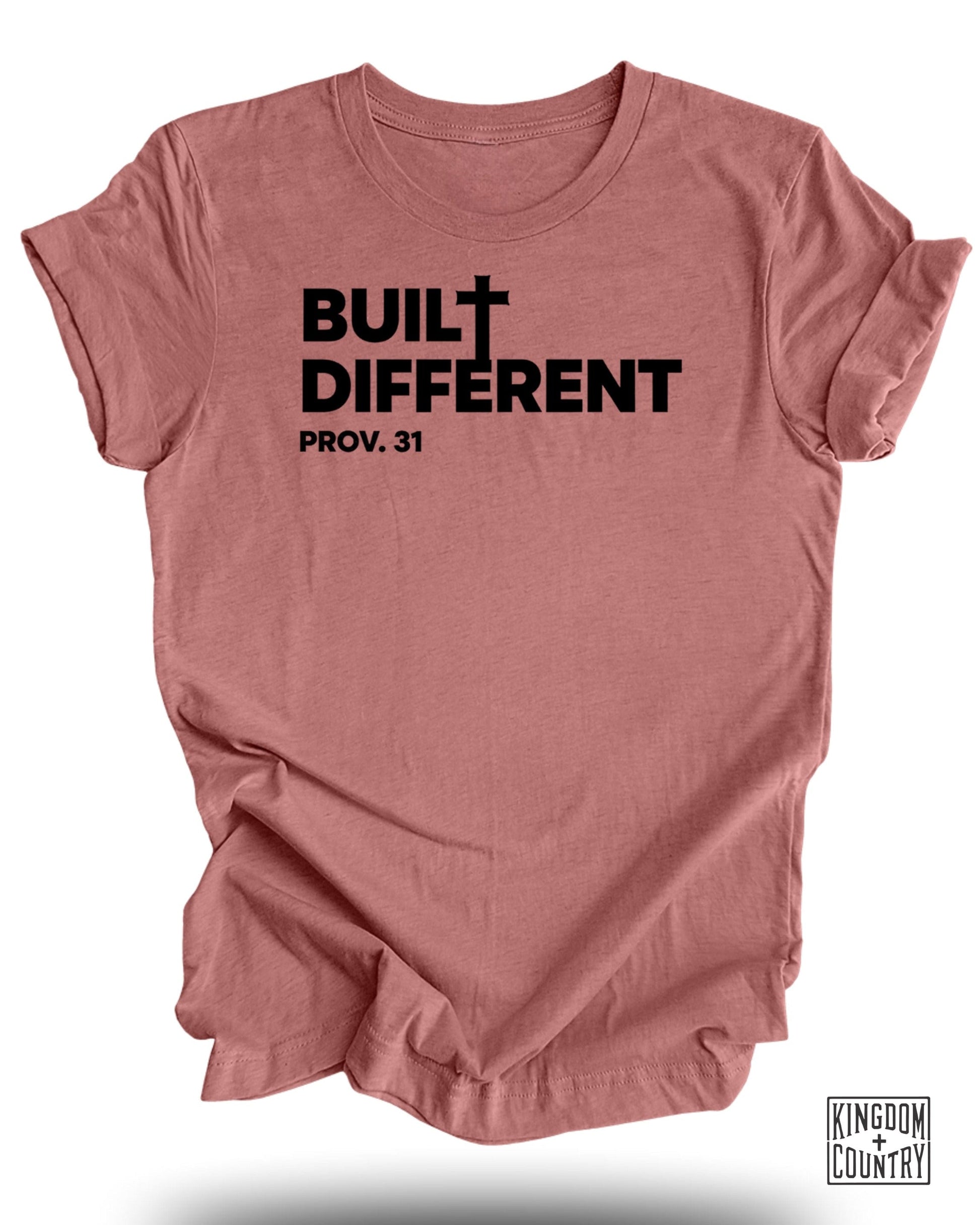 Rose-colored t-shirt with black text "BUILT DIFFERENT PROV. 31" and small logo.