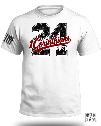White t-shirt with distressed "24 Corinthians 9:24" graphic and US flag patch.