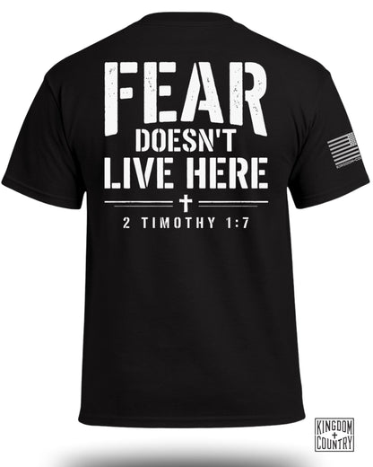 Black t-shirt with white text "FEAR DOESN'T LIVE HERE" and "2 TIMOTHY 1:7".