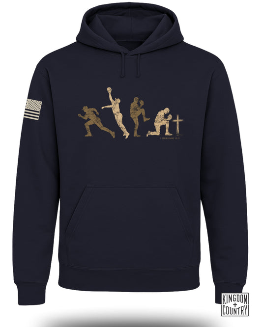 Dark navy hoodie with graphic of baseball player progression and 1 Corinthians 10:31.