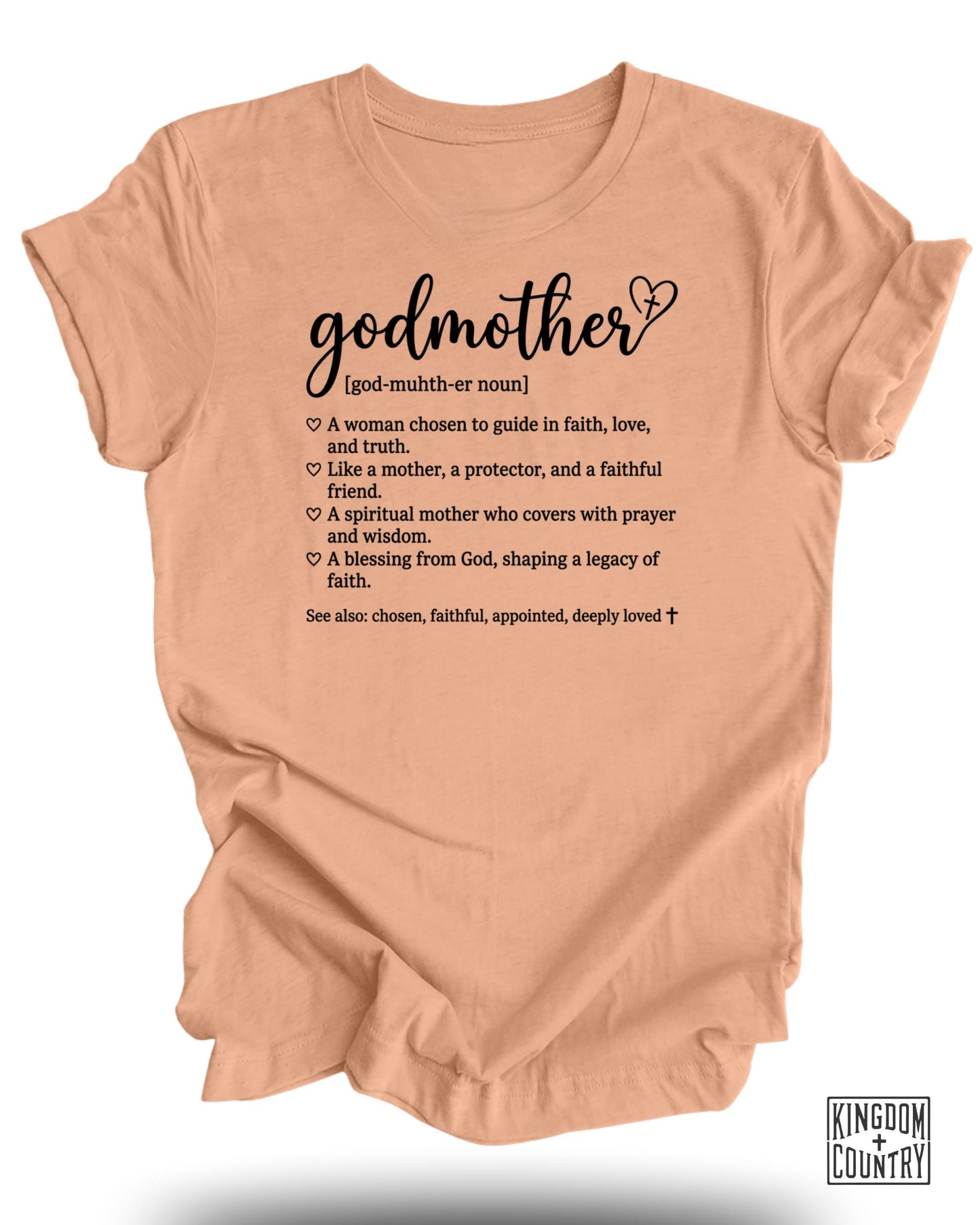 Peach t-shirt with "godmother" text and definitions, plus Kingdom Country logo.