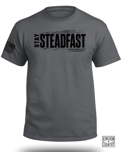 Grey t-shirt with "STAY STEADFAST" and "1 CORINTHIANS 15:58" text.