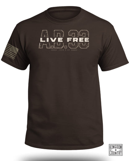 Brown crewneck t-shirt with the distressed text Live Free AD 33 and John 8:36 on the chest.