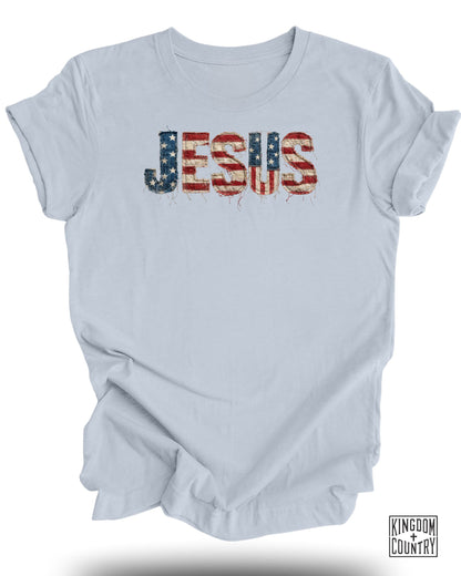 Light blue t-shirt with "JESUS" in distressed American flag design.
