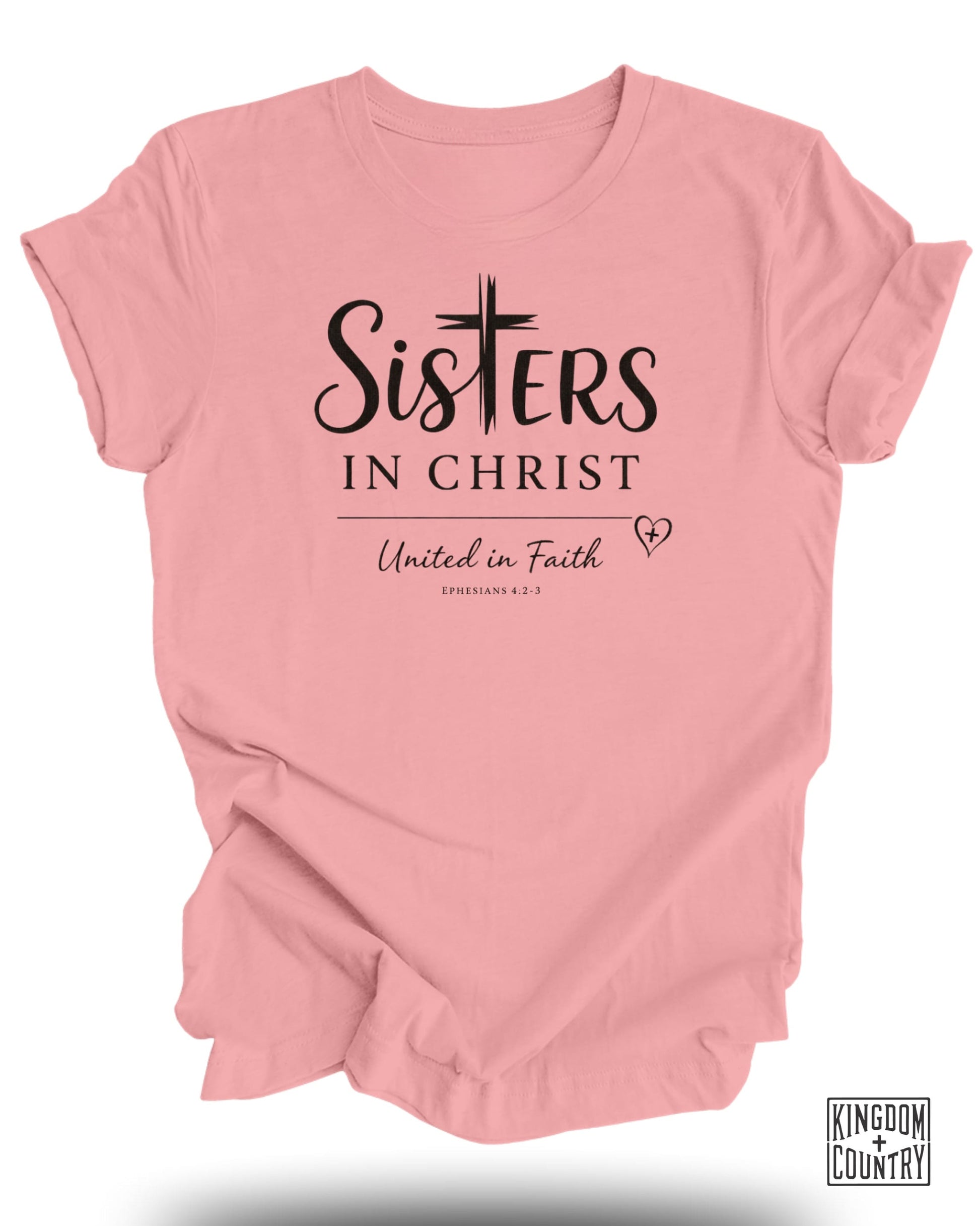 Pink t-shirt with "Sisters in Christ" and "United in Faith" text.