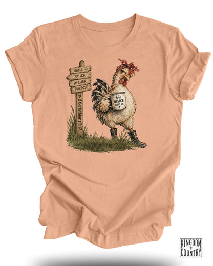 Chicken with bandana holding mug that says "His Grace Fuels Me" near a signpost.