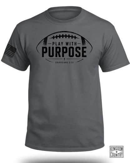 Dark grey t-shirt with a distressed football graphic and "PLAY WITH PURPOSE" text.
