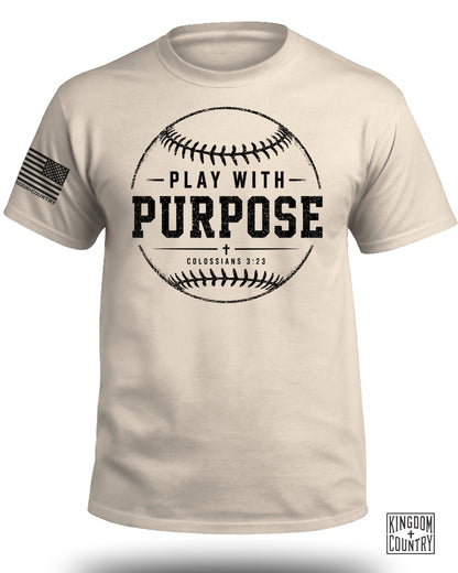 Light tan t-shirt with a distressed baseball graphic and "PLAY WITH PURPOSE COLOSSIANS 3:23" text.