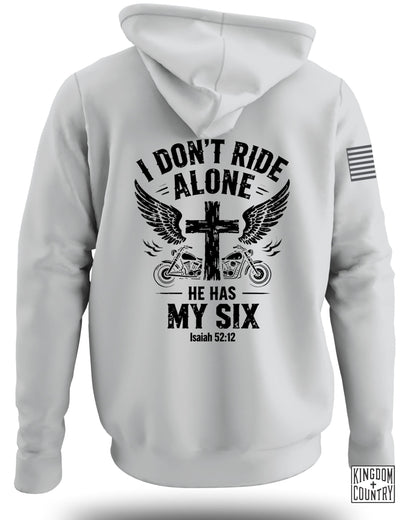 White hoodie with "I DON'T RIDE ALONE HE HAS MY SIX Isaiah 52:12" graphic.