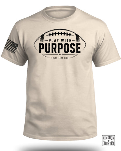 Cream t-shirt with football graphic, "Play With Purpose" text, and Colossians 3:23.