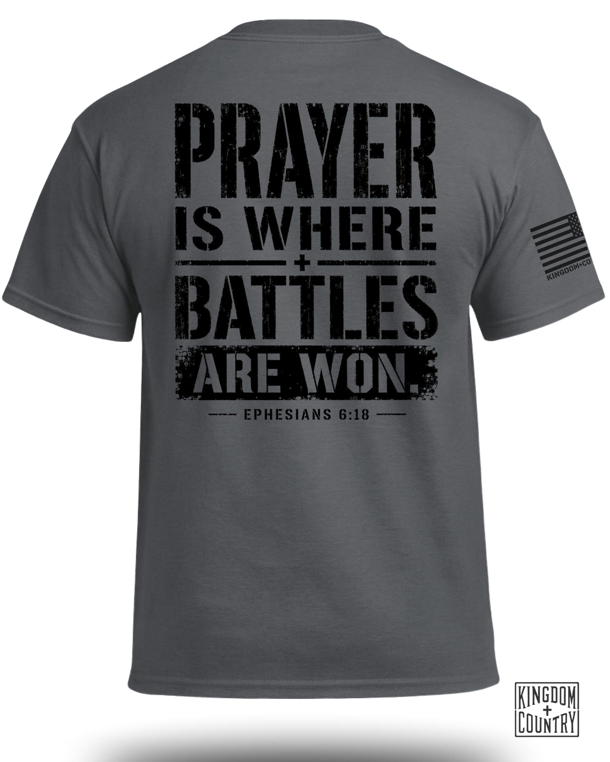 Dark grey t-shirt with black text: "PRAYER IS WHERE BATTLES ARE WON. EPHESIANS 6:18".