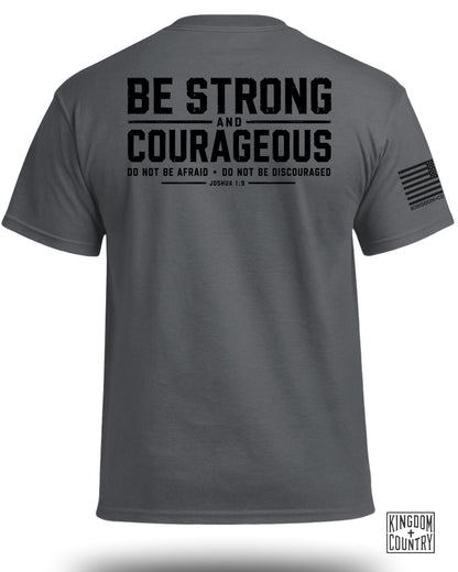 Gray t-shirt with "BE STRONG AND COURAGEOUS" text and Joshua 1:9 scripture.