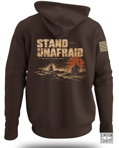 Brown hoodie with "STAND UNAFRAID" text and biblical verse graphic.