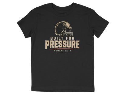 Black t-shirt with vintage football helmet and "Built for Pressure Romans 5:3-4" text.