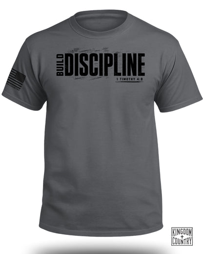 Dark grey t-shirt with "BUILD DISCIPLINE" and "1 TIMOTHY 4:8" text.
