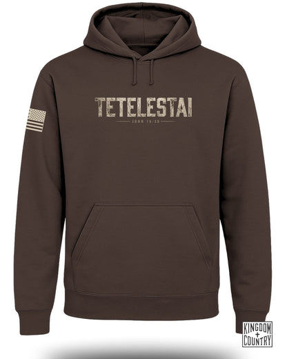 Brown hooded sweatshirt with "TETEL'ESTAI JOHN 19:30" text and US flag patch.