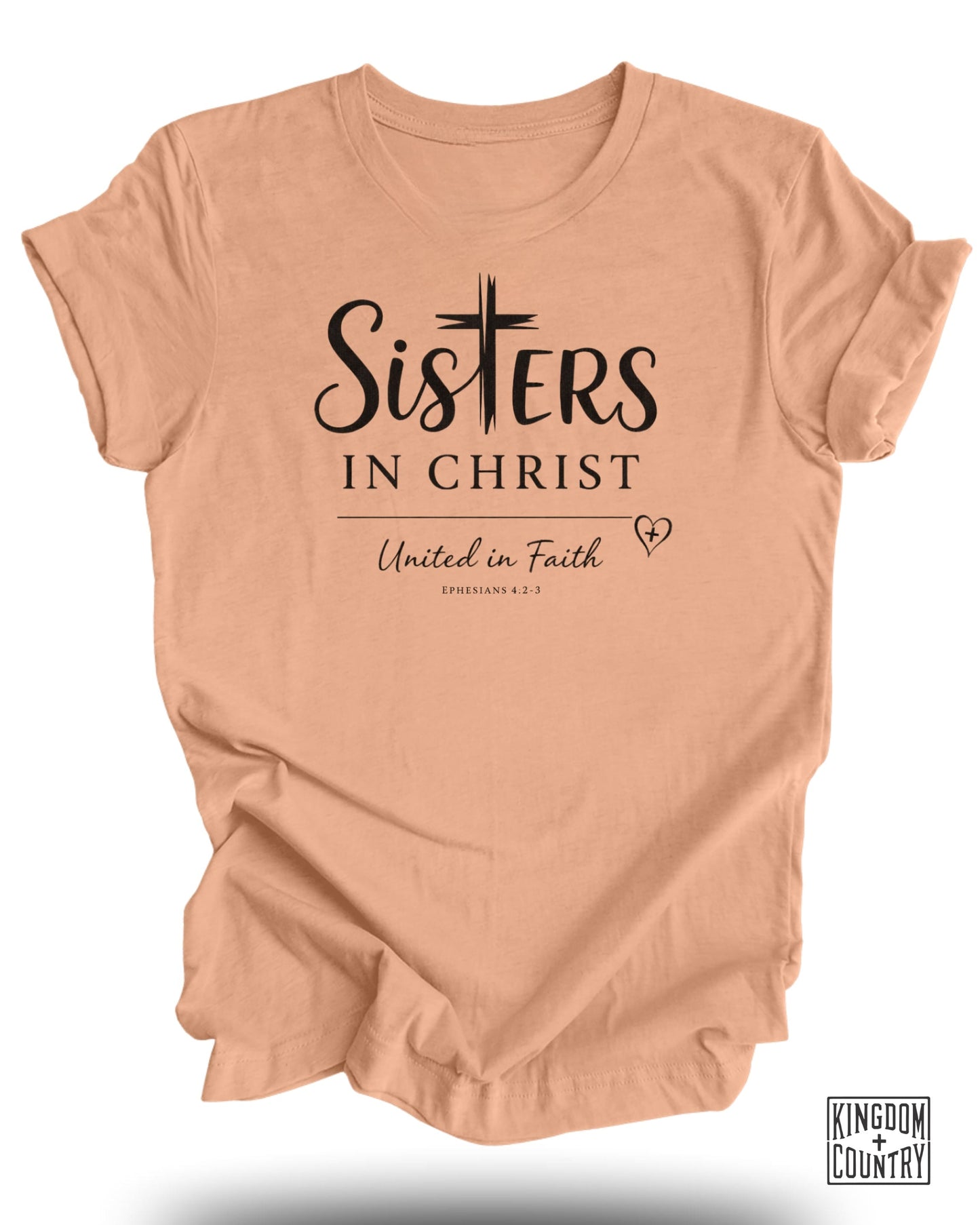 Peach t-shirt with "Sisters in Christ" and "United in Faith" text.