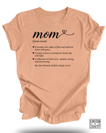 Peach t-shirt with "mom" definition in black text.