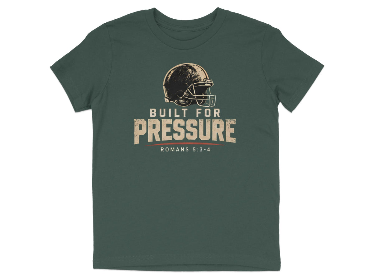 Dark green t-shirt with a distressed football helmet graphic and text reading "BUILT FOR PRESSURE ROMANS 5:3-4".