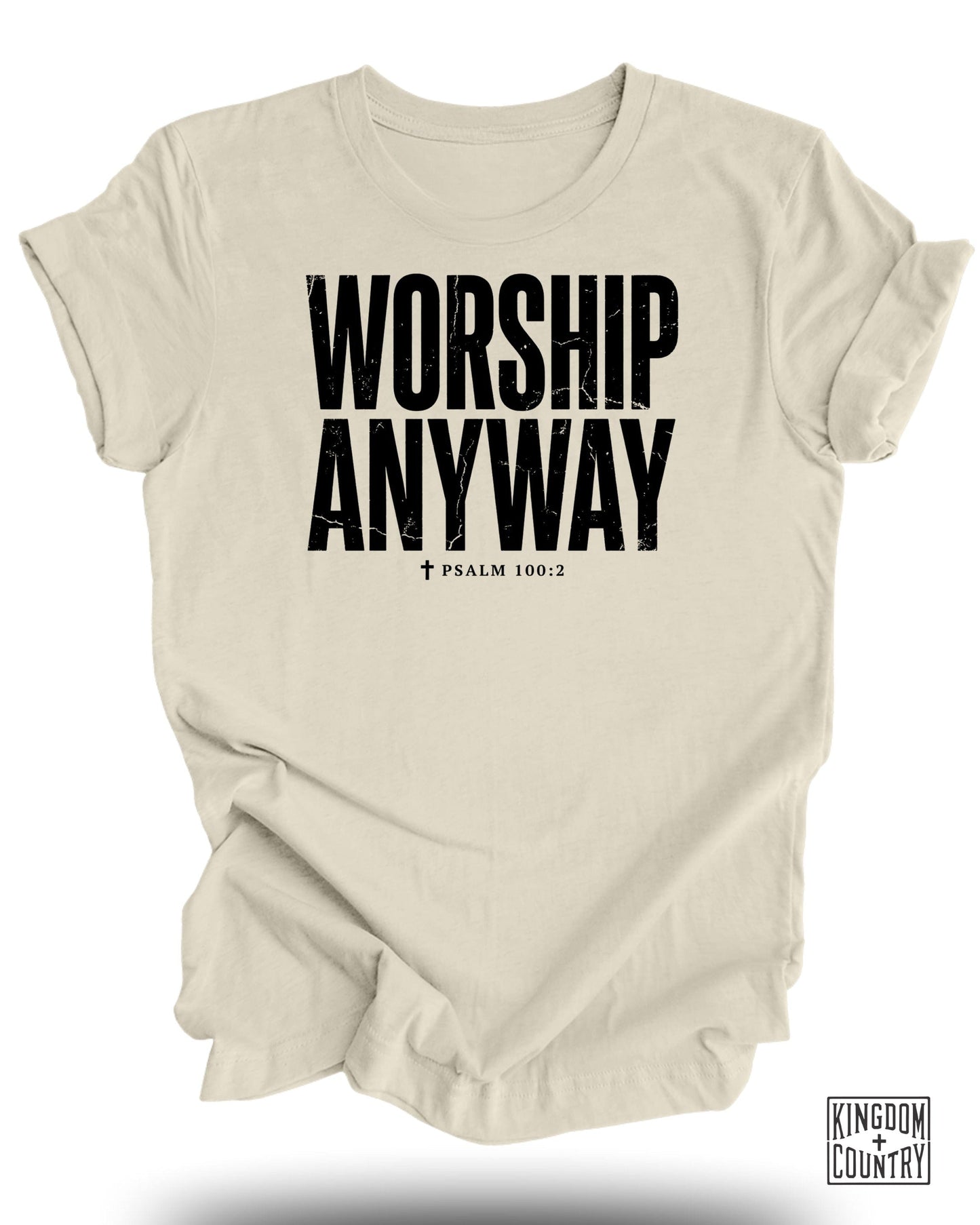 Cream t-shirt with black text "WORSHIP ANYWAY" and "PSALM 100:2".