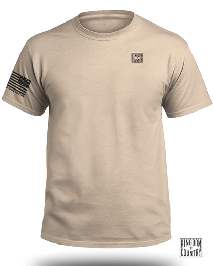 Tan t-shirt with Kingdom + Country logo and American flag on sleeve