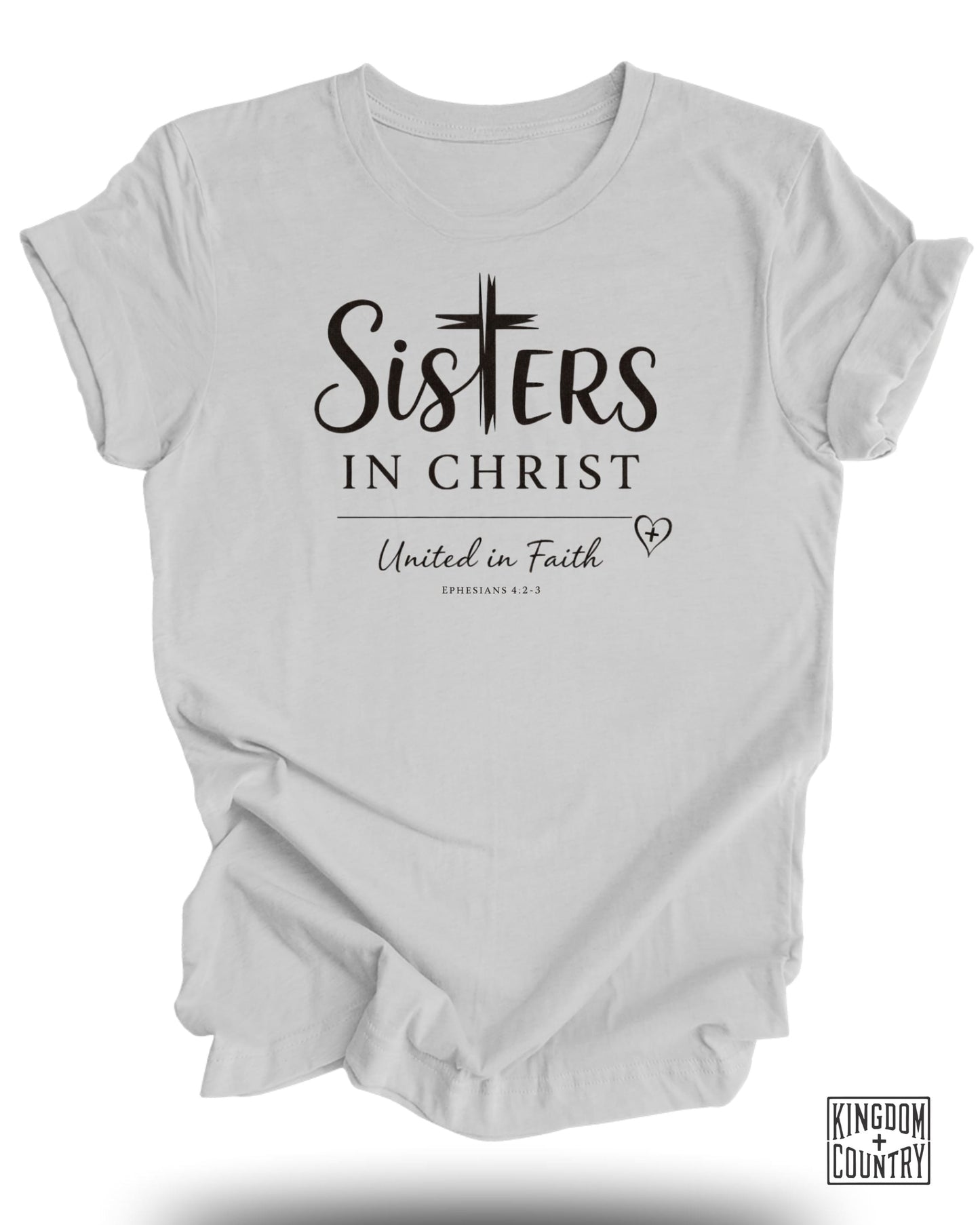 White t-shirt with "Sisters in Christ United in Faith" and "Ephesians 4:2-3" text.