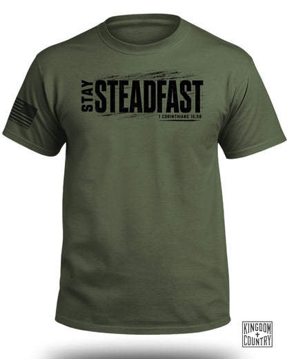 Olive green t-shirt with "STAY STEADFAST" and scripture 1 Corinthians 15:58.