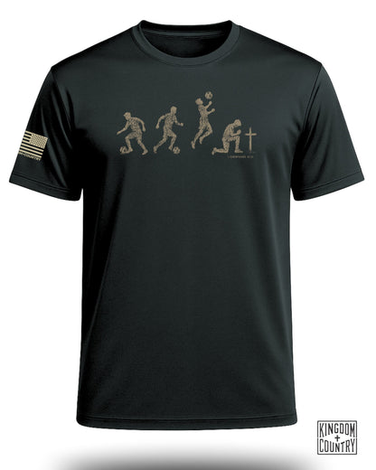Black t-shirt with evolution of soccer player design and American flag patch.