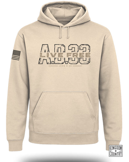 Beige hooded sweatshirt featuring large AD 33 text on the chest, an American flag on the sleeve, and a front pocket.