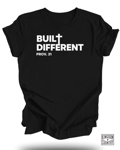Black t-shirt with white text "BUILT DIFFERENT PROV. 31" and a small cross.