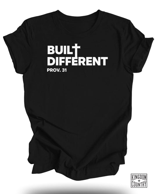 Black t-shirt with white text "BUILT DIFFERENT PROV. 31" and a small cross.