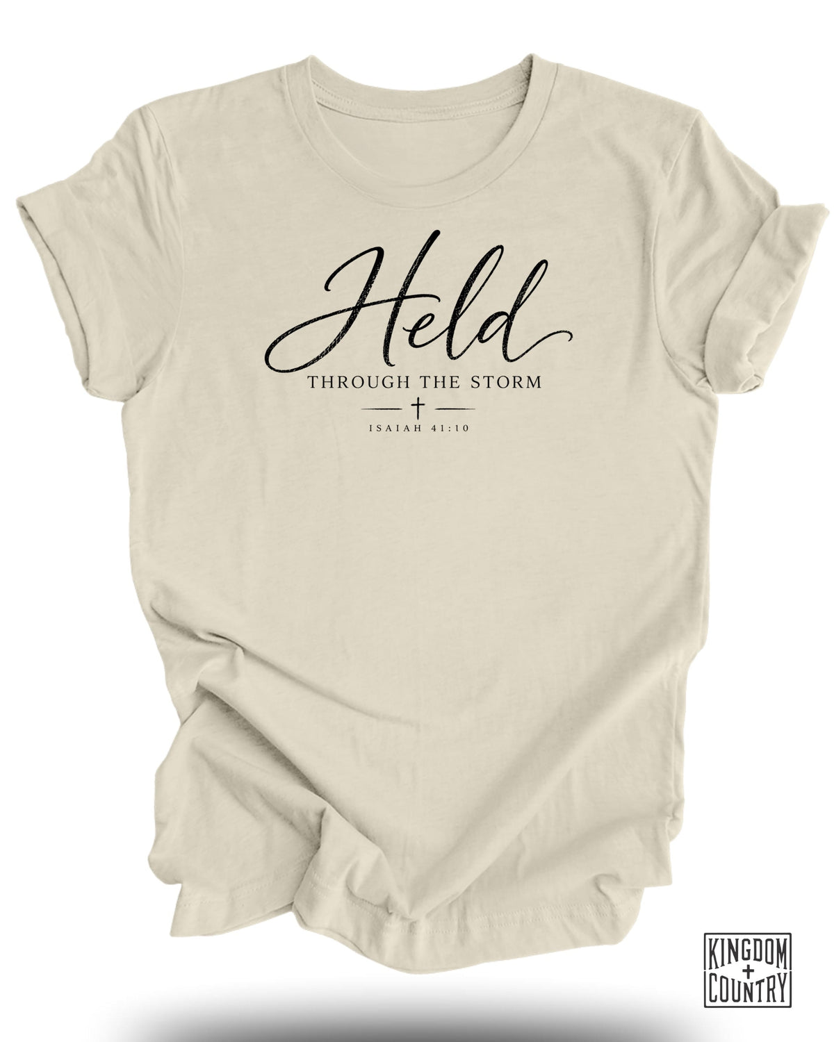Cream t-shirt with "Held Through The Storm" and Isaiah 41:10.