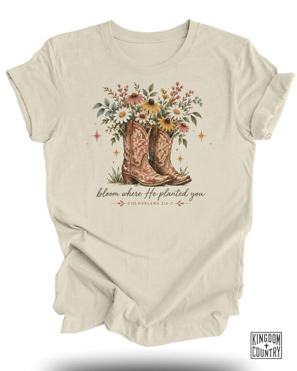 Cream t-shirt with cowboy boots, flowers, and text "bloom where He planted you".